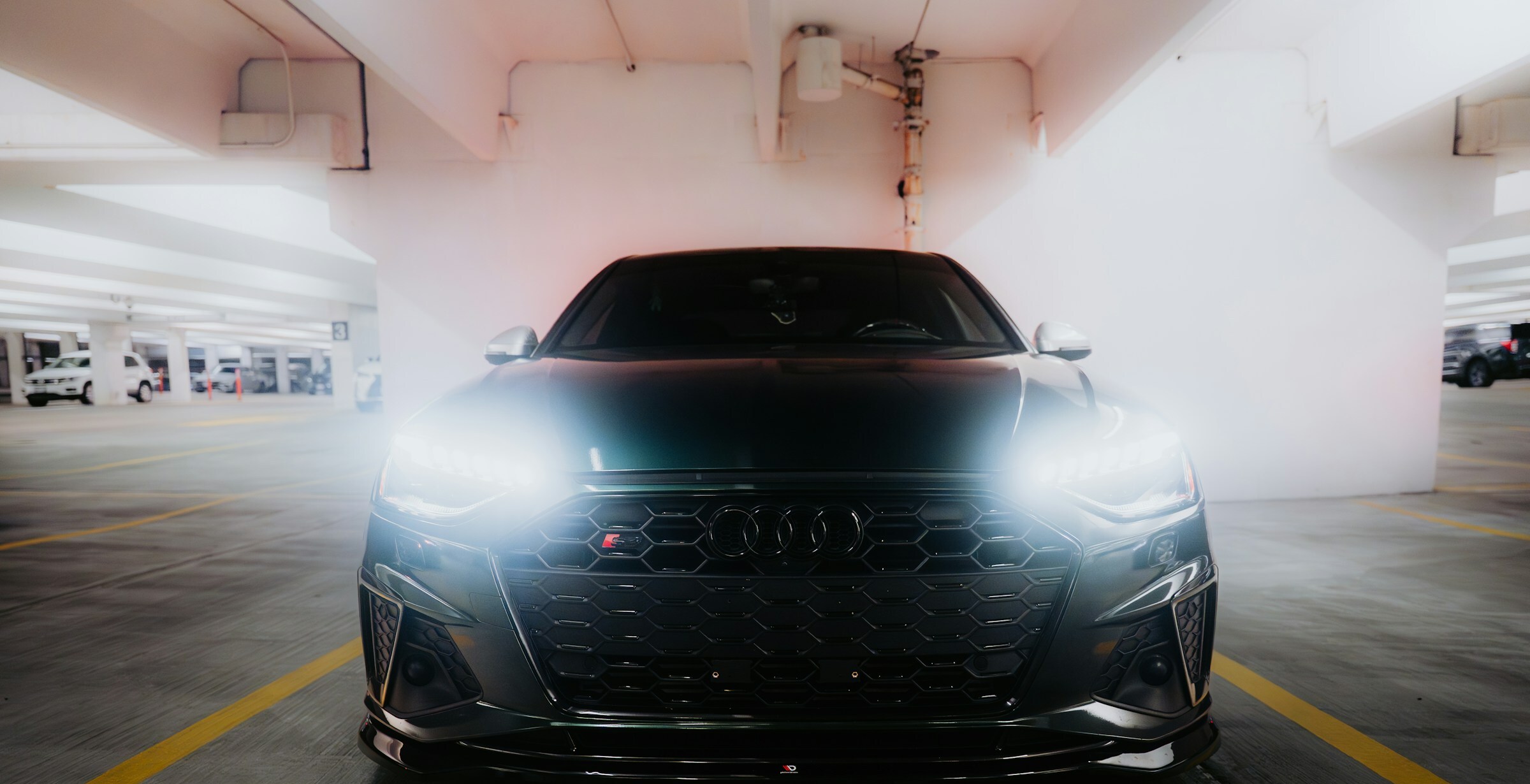 A clean luxury vehicle in a private garage